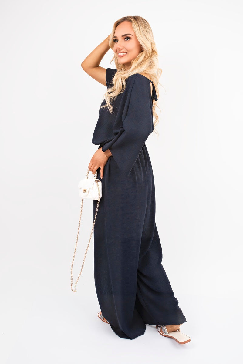 Wide Leg V Neck Jumpsuit with Back Tie Detail